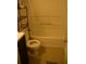Bathroom featuring a toilet, a tub and shower combination, and a dark vanity at 10252 Commons Xing, Jonesboro, GA 30238