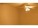 Bedroom with ceiling fan and light fixture, tan painted walls at 10252 Commons Xing, Jonesboro, GA 30238