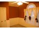 Bedroom with carpet flooring, ceiling fan, windows with blinds and curtains at 10252 Commons Xing, Jonesboro, GA 30238
