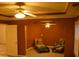 Spacious bedroom with ceiling fan and sitting area featuring comfortable lounge chairs at 10252 Commons Xing, Jonesboro, GA 30238
