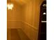 Classic dining room featuring wainscoting and stylish chandelier at 10252 Commons Xing, Jonesboro, GA 30238