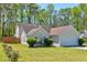Charming home with well-maintained lawn, mature trees, and inviting curb appeal at 10252 Commons Xing, Jonesboro, GA 30238