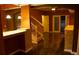 Open-concept living room with hardwood floors, natural light, and staircase at 10252 Commons Xing, Jonesboro, GA 30238
