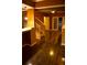 Open-concept living room with hardwood floors, natural light, and staircase at 10252 Commons Xing, Jonesboro, GA 30238