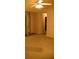 Bright living room features a ceiling fan and an open doorway at 10252 Commons Xing, Jonesboro, GA 30238