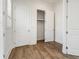 Bedroom features a large closet, hardwood floors, and natural light at 11335 Bennett Ln, Johns Creek, GA 30097