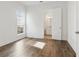 Bedroom features hardwood floors and an open doorway to the bathroom at 11335 Bennett Ln, Johns Creek, GA 30097