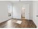 Bedroom featuring hardwood floors and an open bathroom at 11335 Bennett Ln, Johns Creek, GA 30097