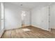 Bedroom features hardwood floors and an open doorway to the bathroom at 11335 Bennett Ln, Johns Creek, GA 30097