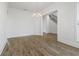 Elegant dining room with hardwood floors, stylish chandelier, and an open entry to the stairs at 11335 Bennett Ln, Johns Creek, GA 30097