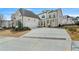 A charming two-story home with a three car garage, brick accents and manicured front yard landscaping at 11335 Bennett Ln, Johns Creek, GA 30097