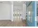 Inviting foyer showcases wood-look floors and an open view to the living area with loads of natural light at 11335 Bennett Ln, Johns Creek, GA 30097