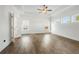 Spacious main bedroom with hardwood floors, tray ceiling, and natural light at 11335 Bennett Ln, Johns Creek, GA 30097