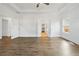 Large main bedroom with wood flooring, ceiling fan, and white trim at 11335 Bennett Ln, Johns Creek, GA 30097