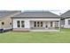 Backyard view of home with a covered patio, perfect for outdoor entertainment at 161 Mooney Rd, Woodstock, GA 30188