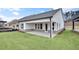 Charming covered patio with brick accents enhances the outdoor living space of this home at 161 Mooney Rd, Woodstock, GA 30188