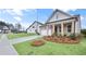 Side view of an attractive home featuring a brick facade and lush green landscaping at 161 Mooney Rd, Woodstock, GA 30188