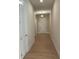 Bright hallway with hardwood floors and neutral walls at 161 Mooney Rd, Woodstock, GA 30188