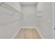 Spacious walk-in closet with shelving for organized storage at 161 Mooney Rd, Woodstock, GA 30188