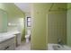 Bathroom with vintage green tile and double vanity at 4956 Oakdale Dr, Douglasville, GA 30135