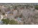 An aerial view of a home nestled amongst trees and other homes in a well-kept neighborhood at 1012 Crown River Pkwy, Mcdonough, GA 30252