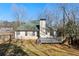 Backyard with deck, privacy fence and a view of neighboring houses at 1012 Crown River Pkwy, Mcdonough, GA 30252