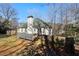Backyard view with a deck, fencing, and a well-manicured lawn at 1012 Crown River Pkwy, Mcdonough, GA 30252