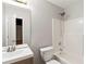 Bathroom with tile shower, neutral paint, and modern fixtures at 1012 Crown River Pkwy, Mcdonough, GA 30252
