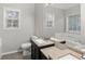 Bathroom features a double sink vanity, tile floors, and large tub with jets at 1012 Crown River Pkwy, Mcdonough, GA 30252