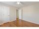 Bedroom with hardwood floors, ceiling fan, and natural light at 1012 Crown River Pkwy, Mcdonough, GA 30252