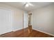 Bedroom with hardwood floors, neutral paint, and a ceiling fan at 1012 Crown River Pkwy, Mcdonough, GA 30252