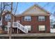 Charming two-story brick home featuring a classic design, arched windows, and a welcoming front porch with white railings at 1012 Crown River Pkwy, Mcdonough, GA 30252