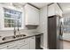 Updated kitchen with stainless steel appliances, granite counters and a view from the sink at 1012 Crown River Pkwy, Mcdonough, GA 30252