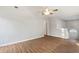 Spacious living room featuring wood floors, neutral walls, and ample natural light at 1012 Crown River Pkwy, Mcdonough, GA 30252
