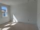 Bright bedroom featuring a window with natural light and fresh white paint at 1582 Driggs Nw Dr # 169, Atlanta, GA 30318