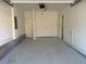 Spacious, clean two-car garage with white walls and concrete flooring at 1582 Driggs Nw Dr # 169, Atlanta, GA 30318