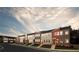 Exterior view of modern townhomes with gray and red siding at 1582 Driggs Nw Dr # 169, Atlanta, GA 30318