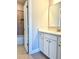 Clean bathroom with white vanity, tile floor, and shower/tub combo at 416 Aristides Way, Canton, GA 30115