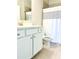 Bathroom boasts a shower/tub combo, vanity with white cabinets, and updated fixtures at 416 Aristides Way, Canton, GA 30115