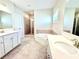 Main bathroom has double sinks, a soaking tub, and a walk-in shower at 416 Aristides Way, Canton, GA 30115