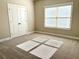 Spacious bedroom with neutral walls, carpeting, and double doors at 416 Aristides Way, Canton, GA 30115