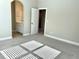 Bright bedroom with ensuite bathroom access and neutral walls at 416 Aristides Way, Canton, GA 30115