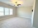 Large bonus room with ceiling fan and neutral carpeting at 416 Aristides Way, Canton, GA 30115