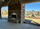 Community outdoor fireplace and seating area near playground at 416 Aristides Way, Canton, GA 30115