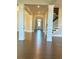 Bright foyer with hardwood floors, columns, and views to the back at 416 Aristides Way, Canton, GA 30115