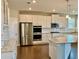 White kitchen with stainless steel appliances and granite countertops at 416 Aristides Way, Canton, GA 30115