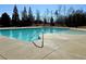 Community lap pool and leisure pool with a large concrete deck at 416 Aristides Way, Canton, GA 30115