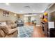 Finished basement featuring hardwood floors, comfortable seating, and an entertainment center at 511 Baxter Way, Marietta, GA 30064
