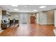 Finished basement featuring stylish hardwood floors, a desk, and storage cabinets at 511 Baxter Way, Marietta, GA 30064