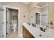 Bathroom featuring double sinks, vanity and a seperate toilet room at 511 Baxter Way, Marietta, GA 30064
